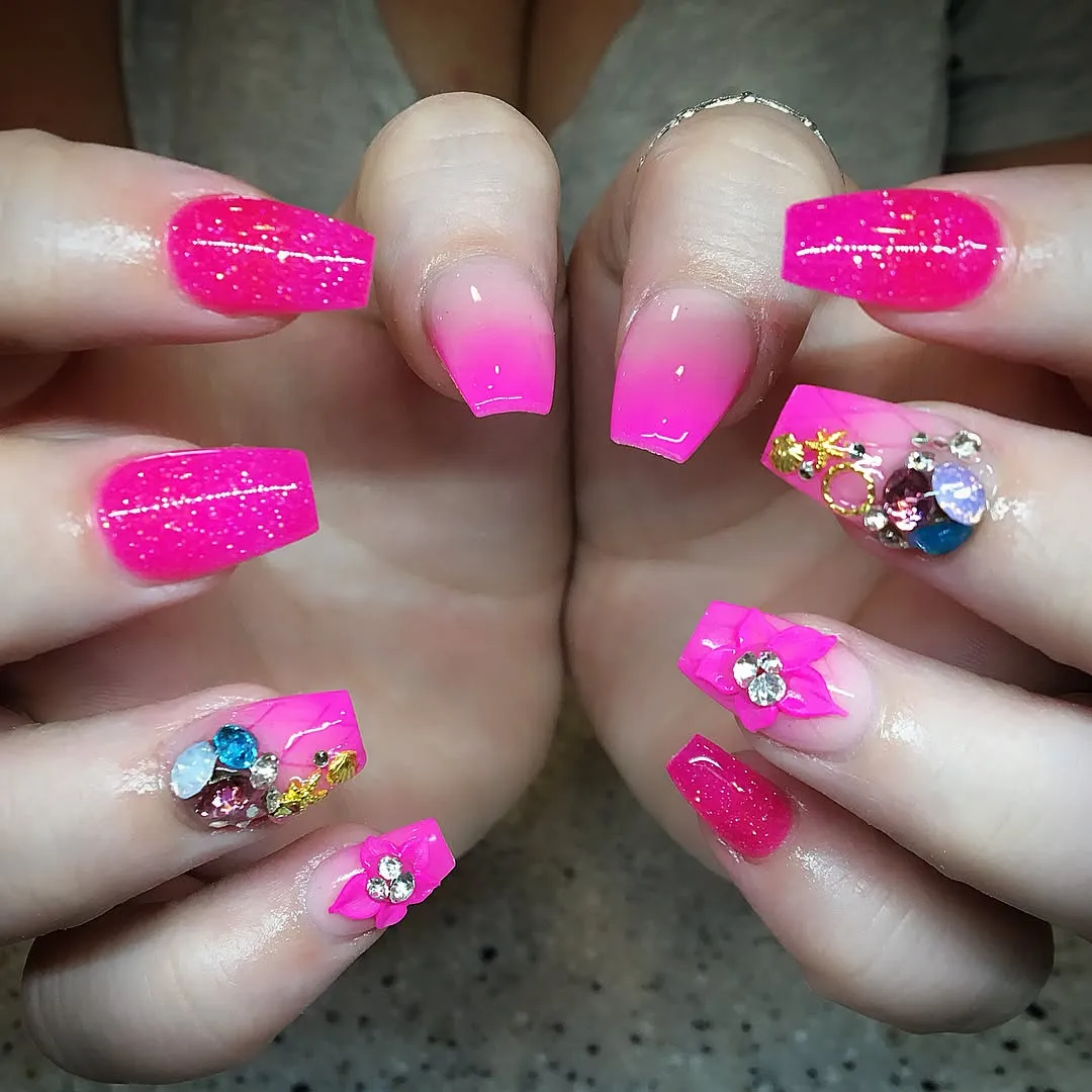 Hot pink ombrΓ© and glitter with heavy rhinestone accents