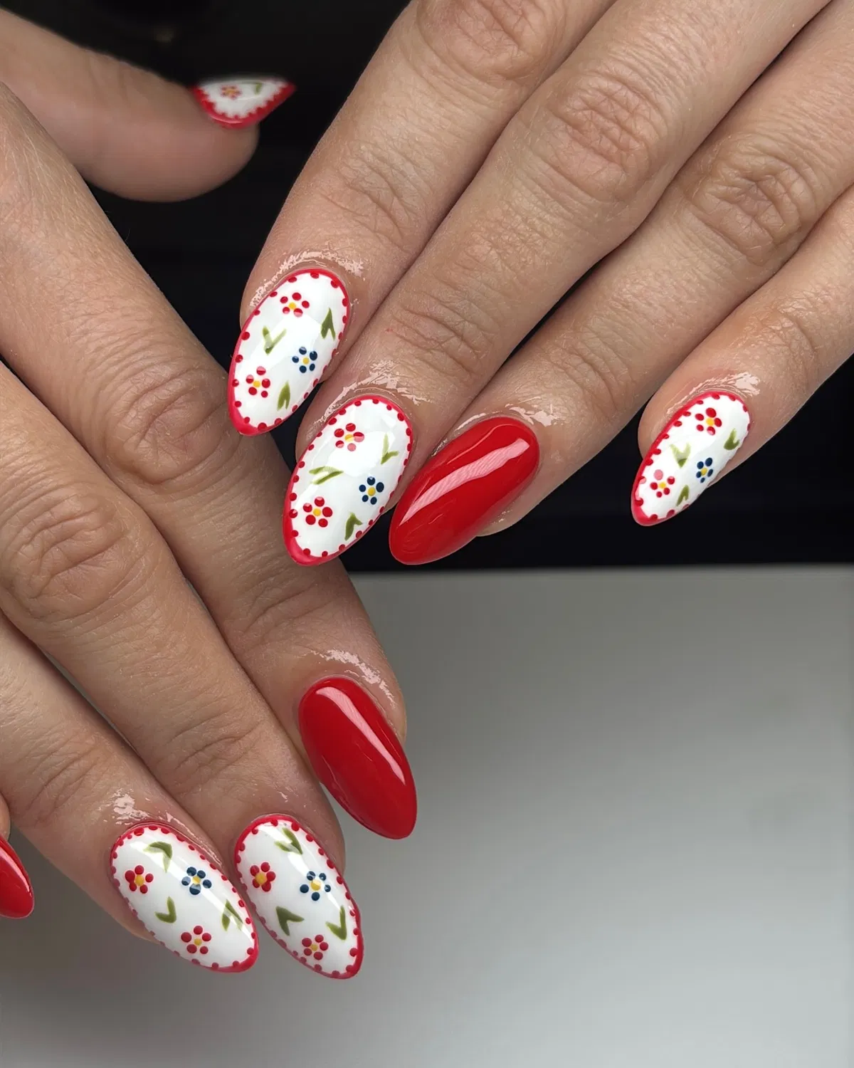 Red solids with white floral nails and dotted borders