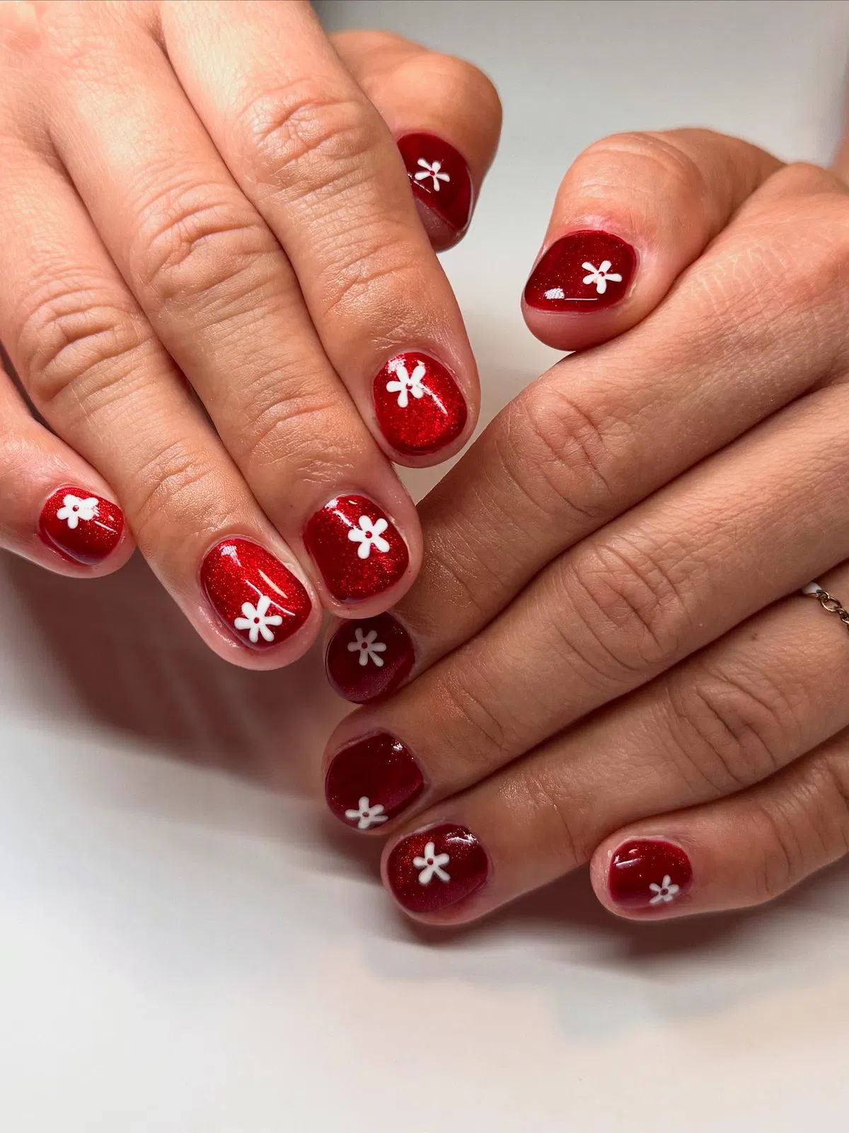 Shimmery deep red with small white flower details