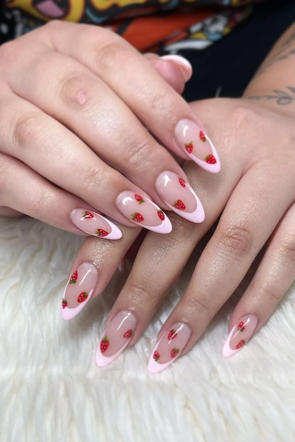 Pink French tips with strawberry motifs