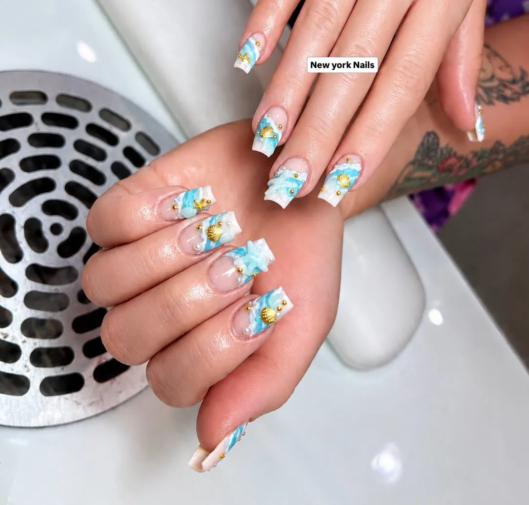 3D white wave tips with gold shell accents