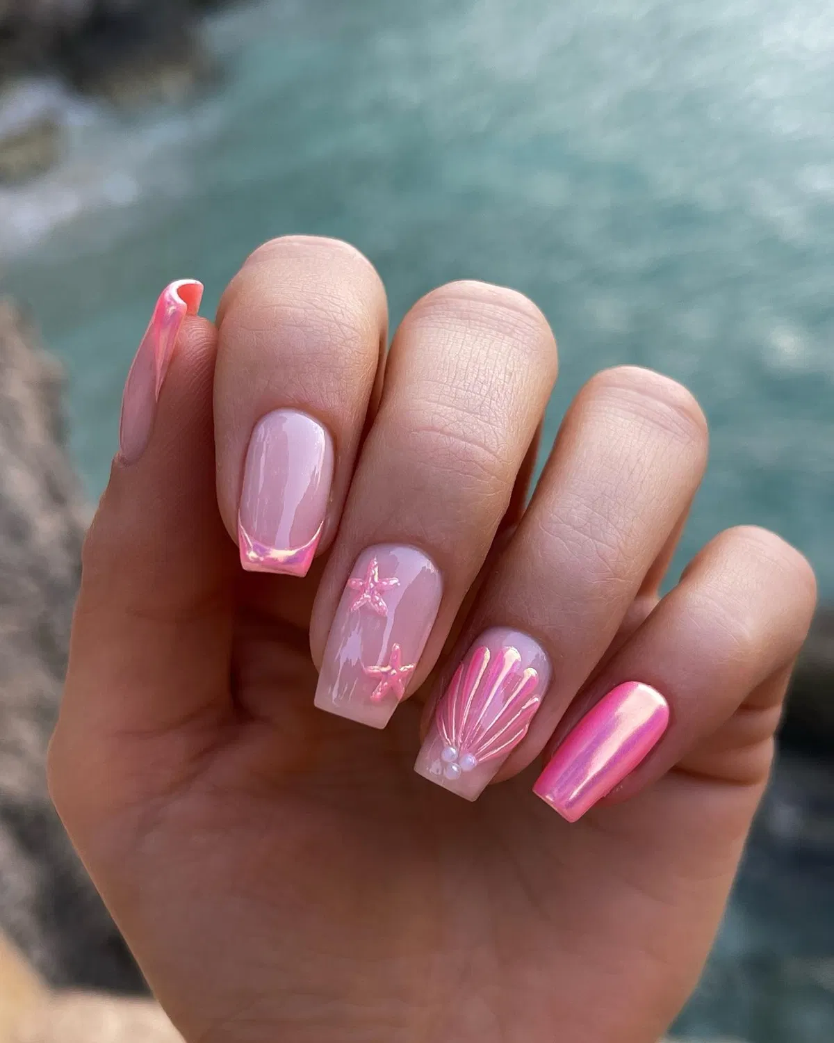 Pastel pearly nails with white polka dots