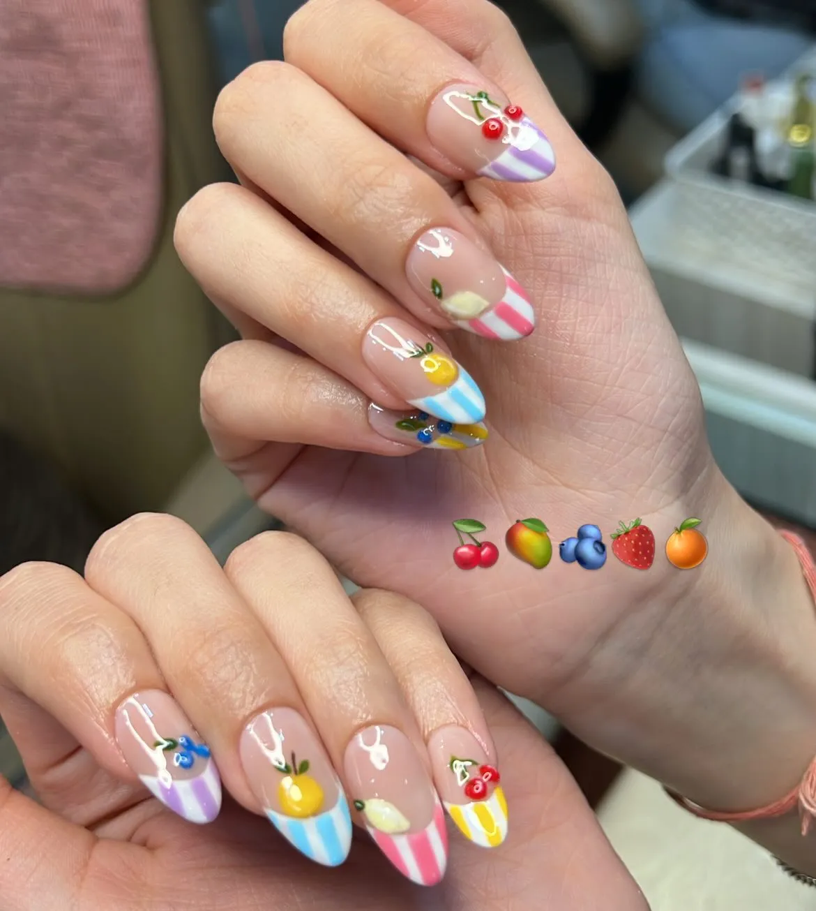 Striped French tips with small fruit illustrations