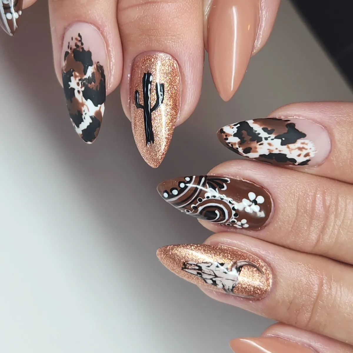 Cow-print mix with rose-gold glitter and western-style silhouettes