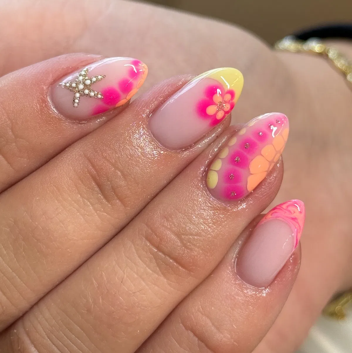 Sheer nude base with neon gradients and 3D starfish detail