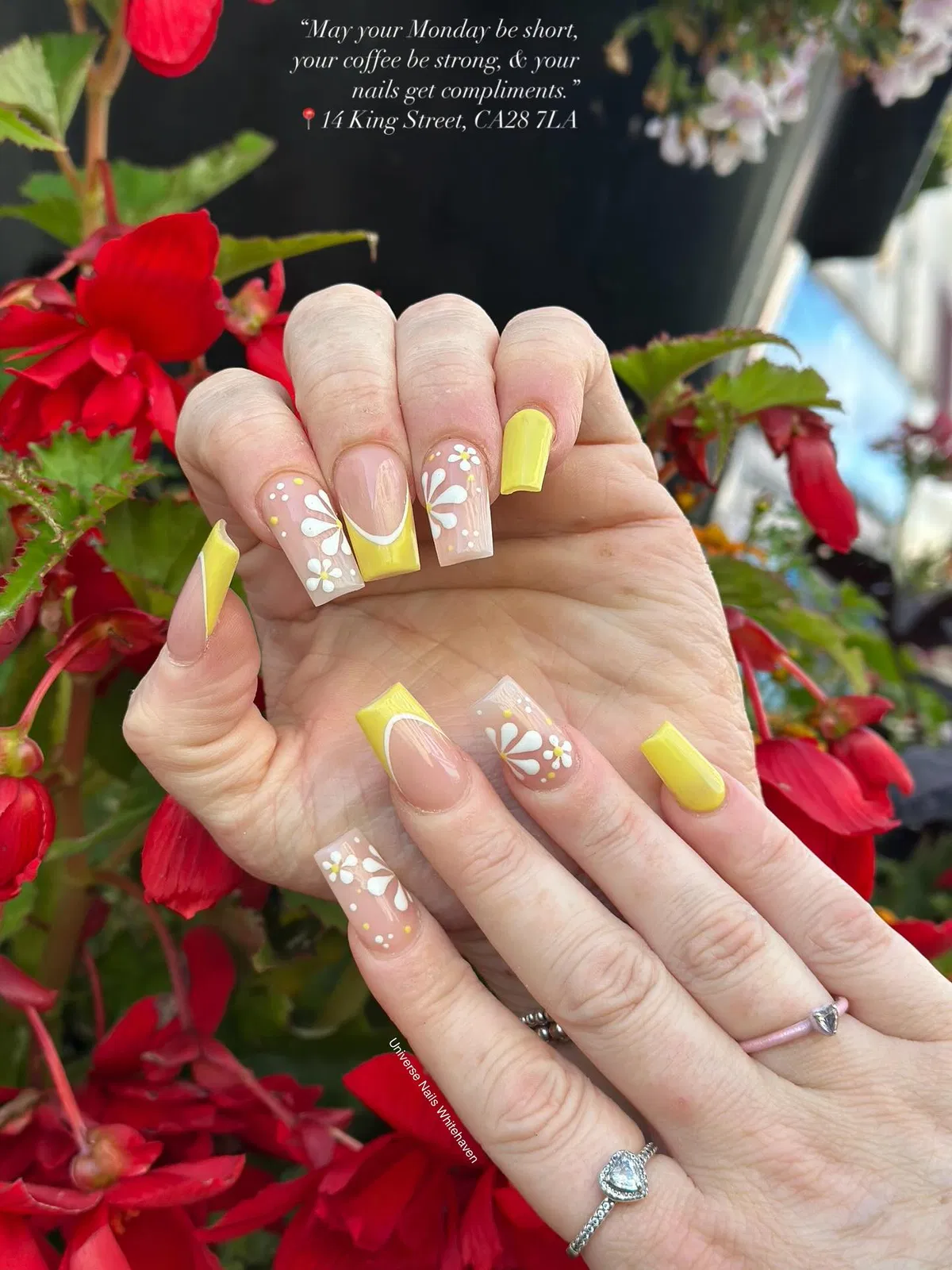 Yellow French tips with white floral detailing