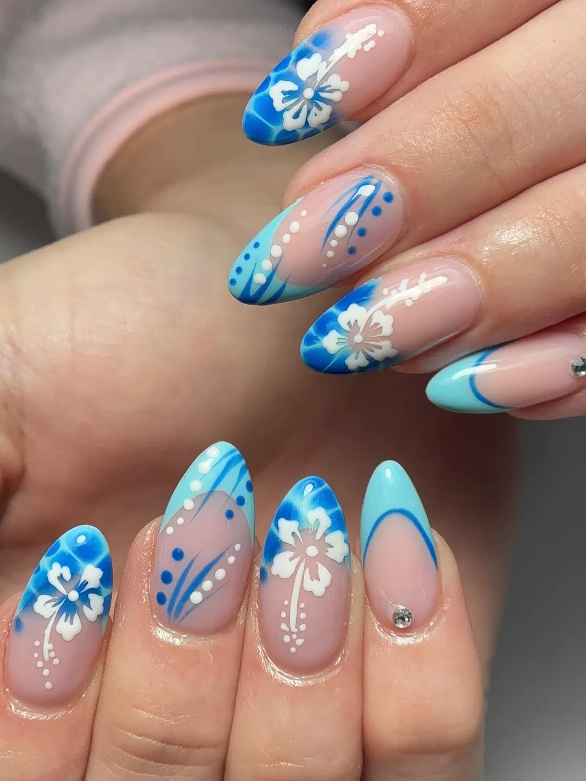 Blue French tips with white floral accents