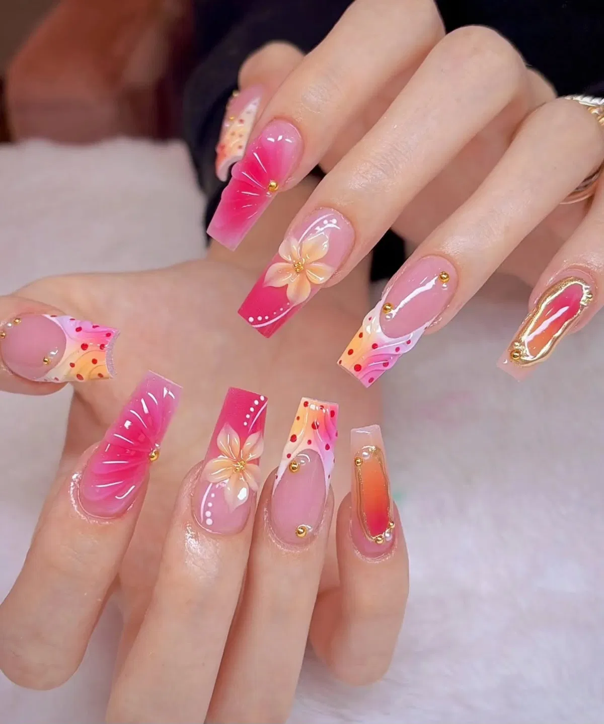 Pink-toned mix with florals, dots, and gold studs