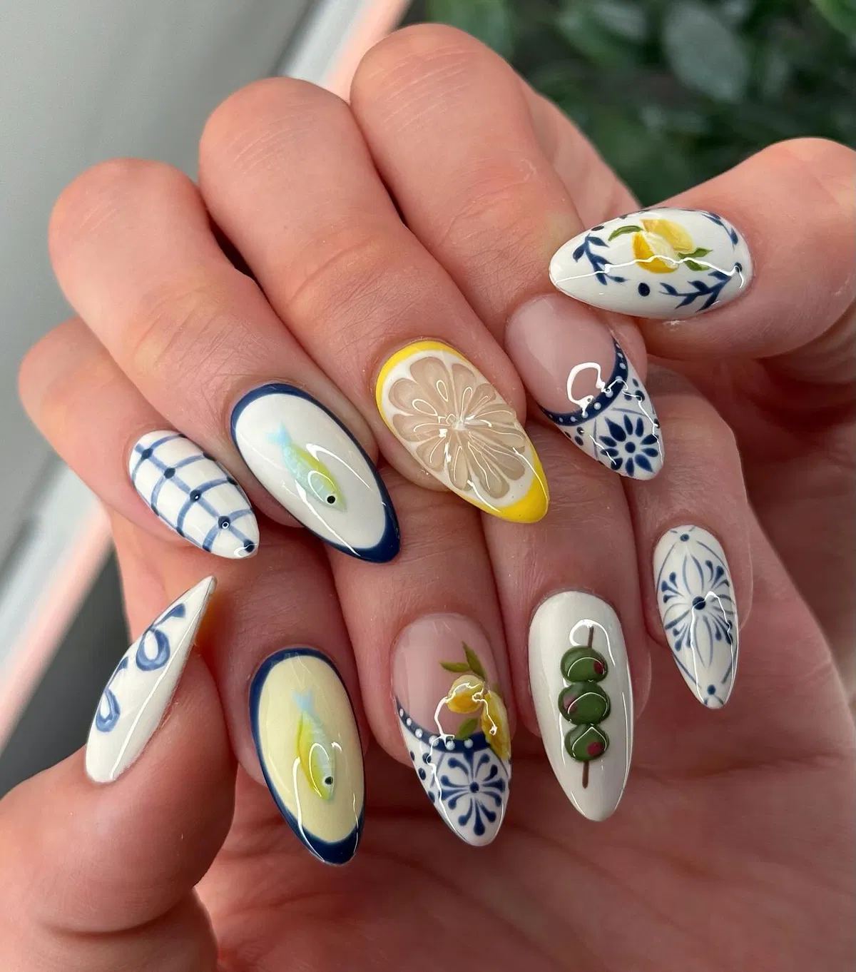 Blue tile-style patterns with lemon and fish accents