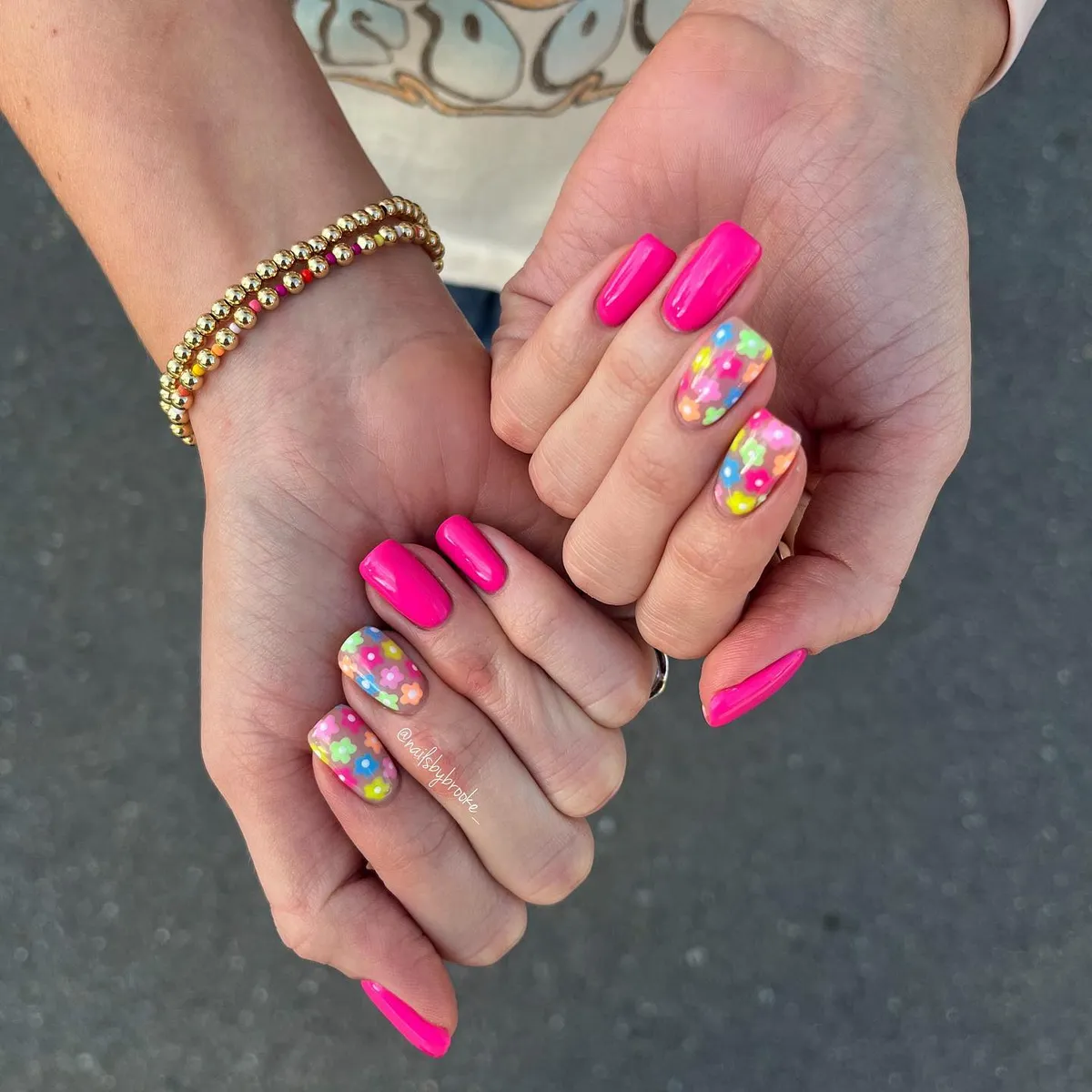 Hot pink nails with multicolor floral accent nails