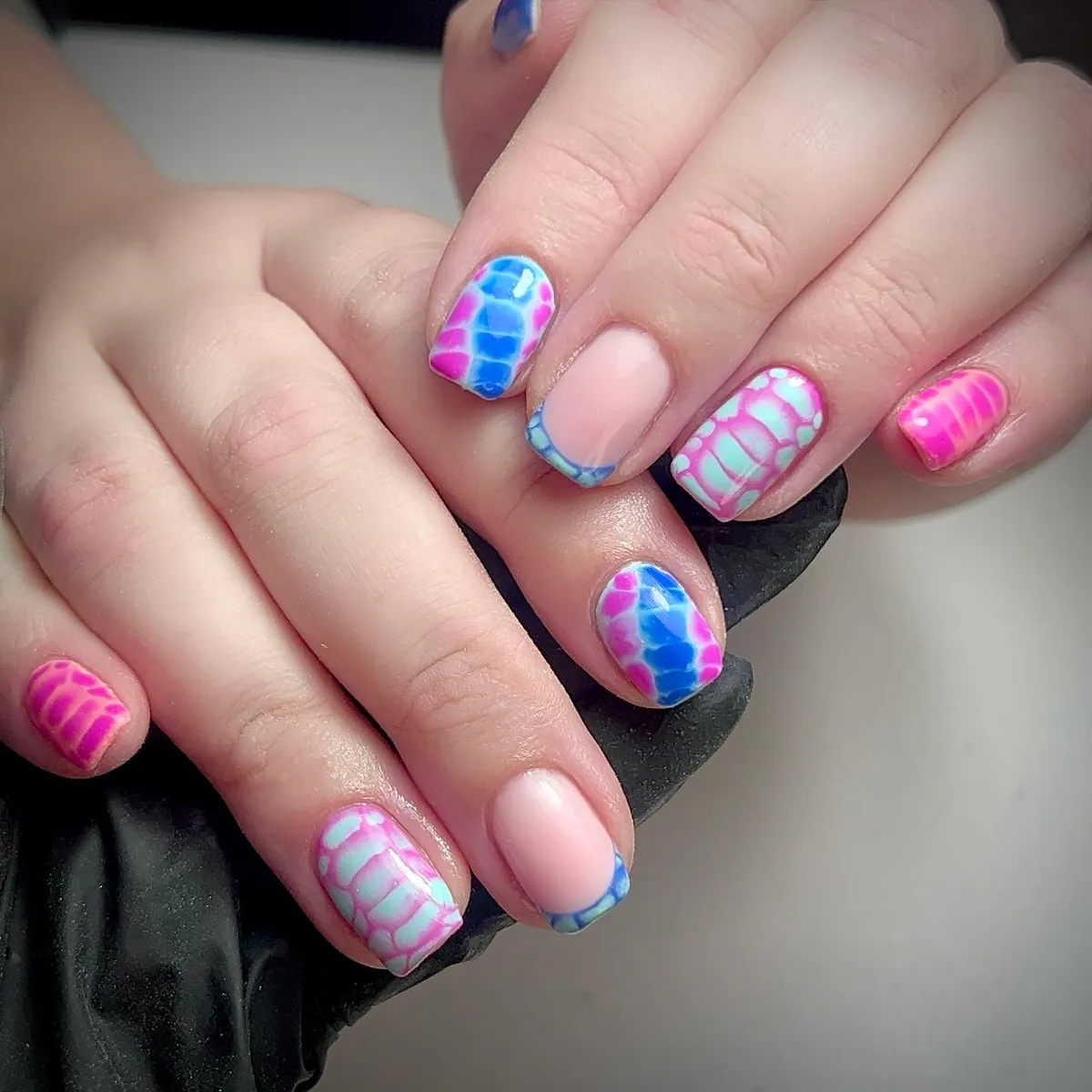 Pink-and-blue mosaic and scale-pattern mix