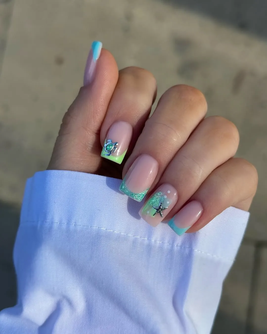 Pastel square French tips with small sea charms