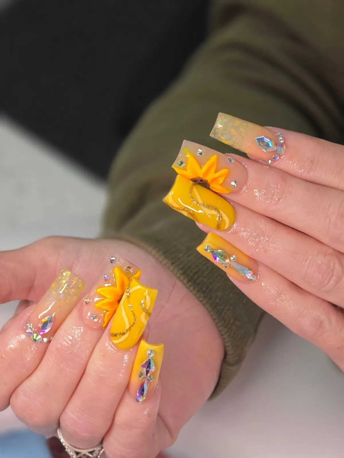 Yellow wavy accents with rhinestones and a 3D flower