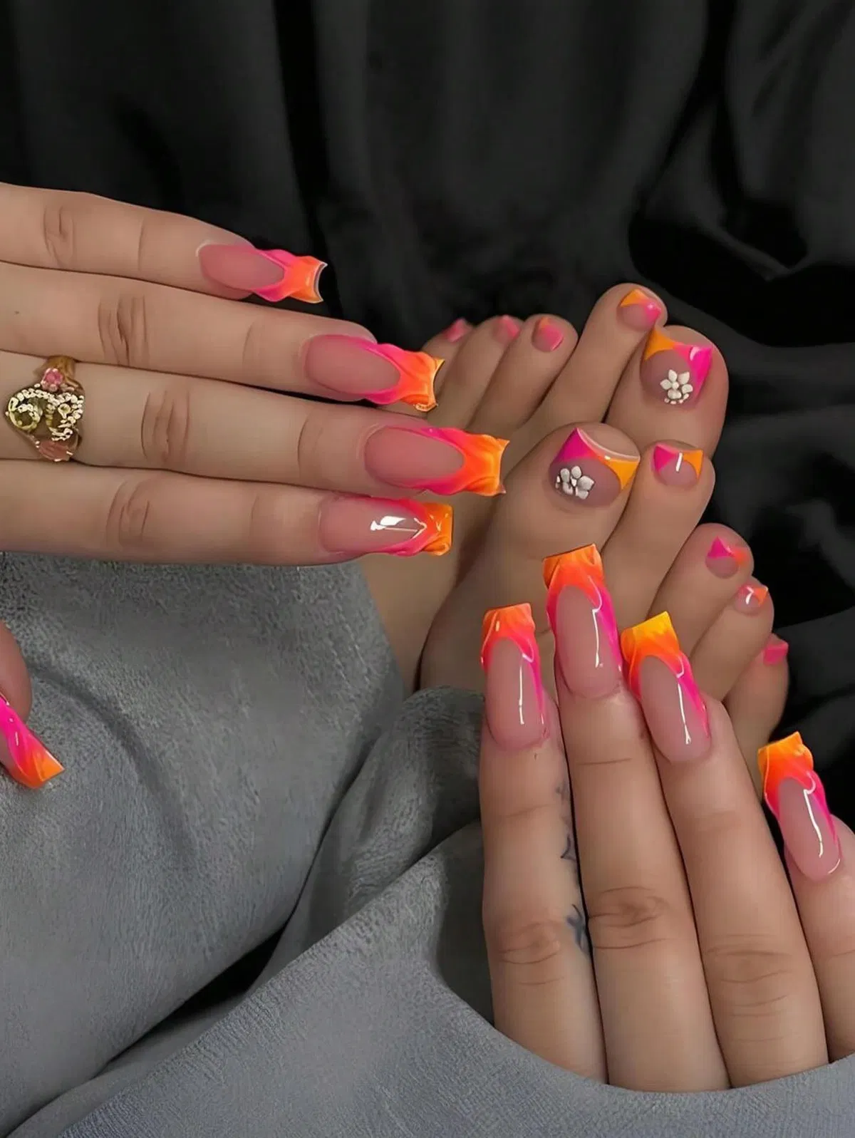 Matching hot pink and orange flame tips with 3D toe flowers