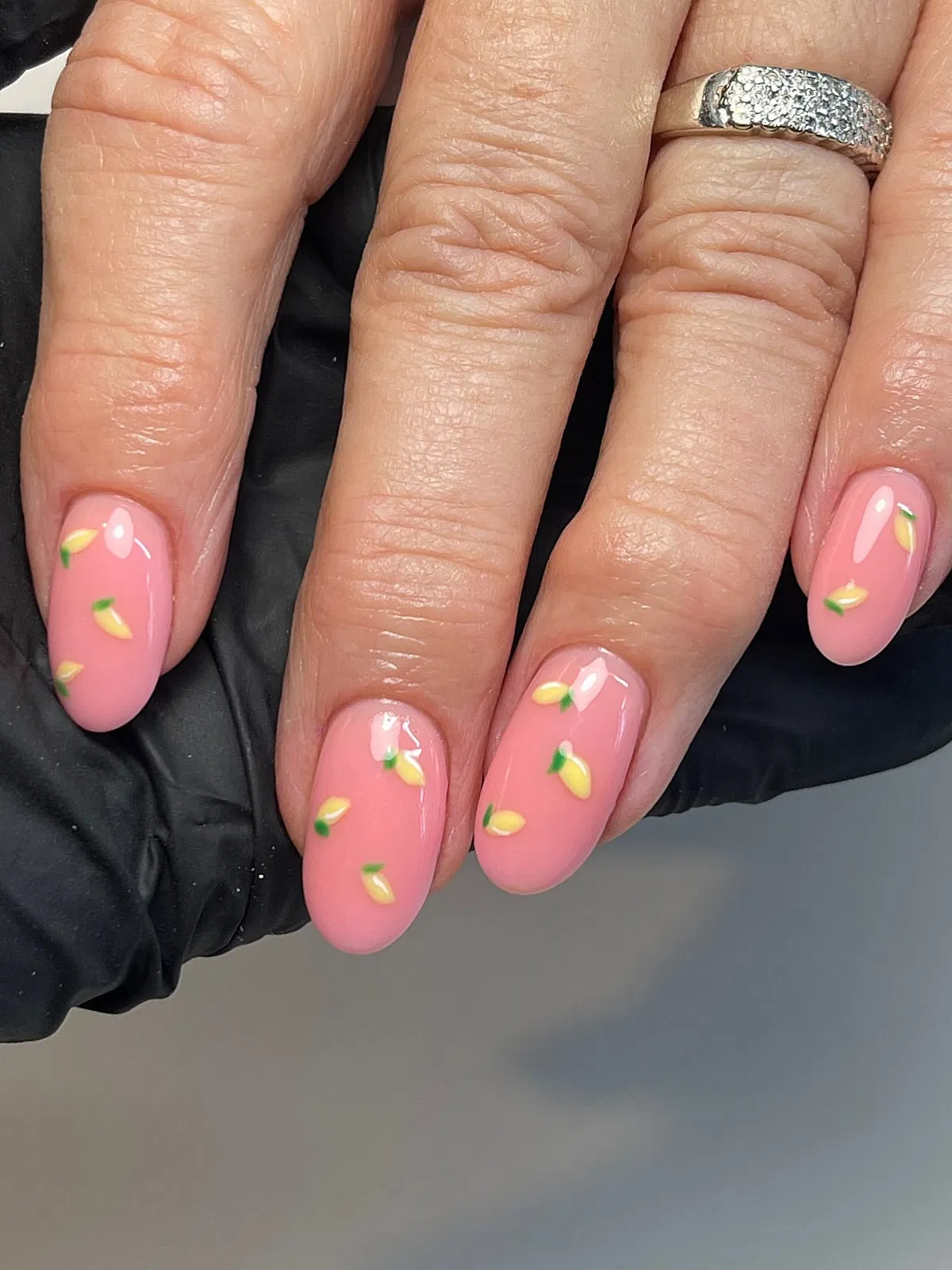Glossy pink with scattered yellow petal motifs