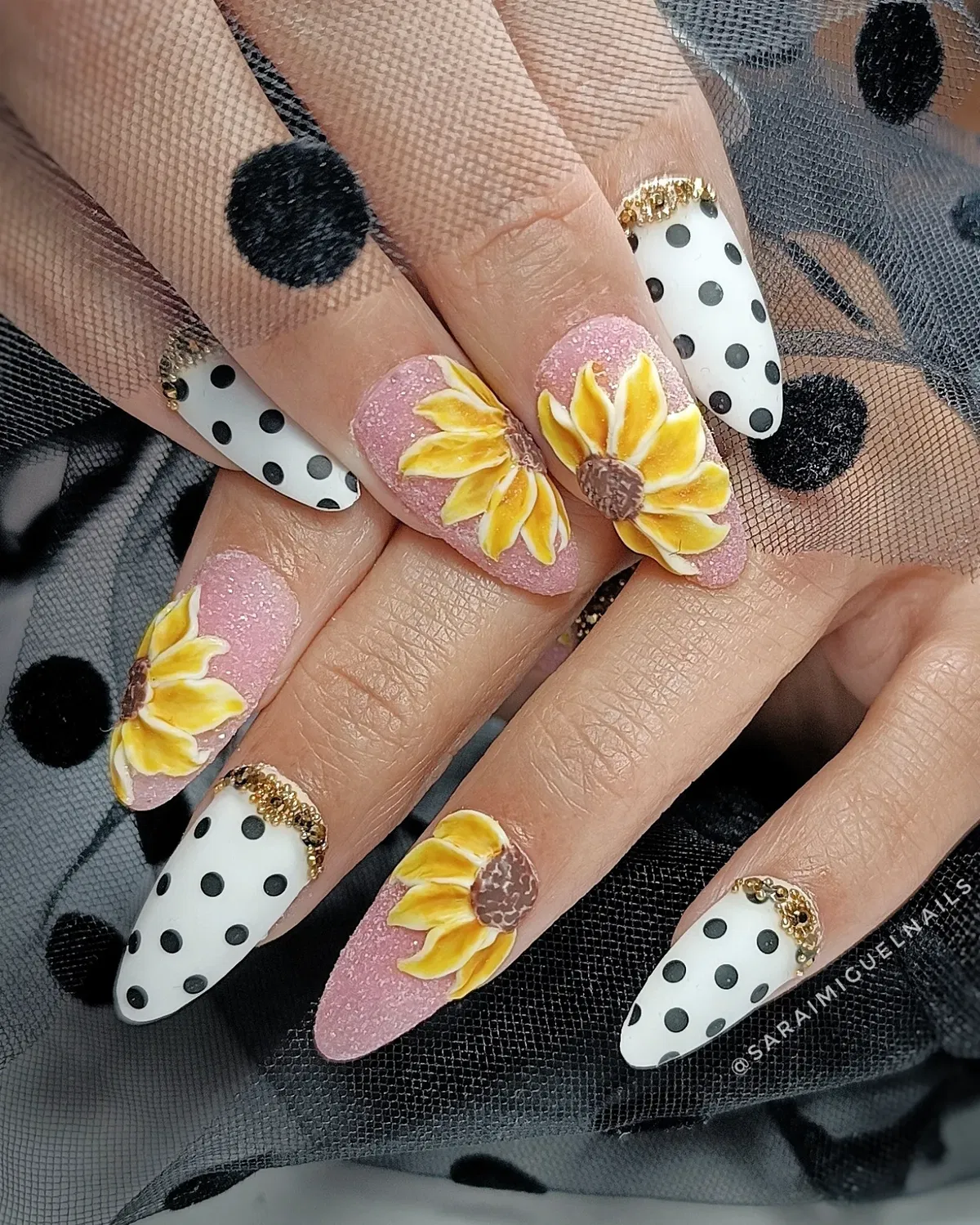Pink glitter sunflowers paired with polka dots and gold cuticle accents