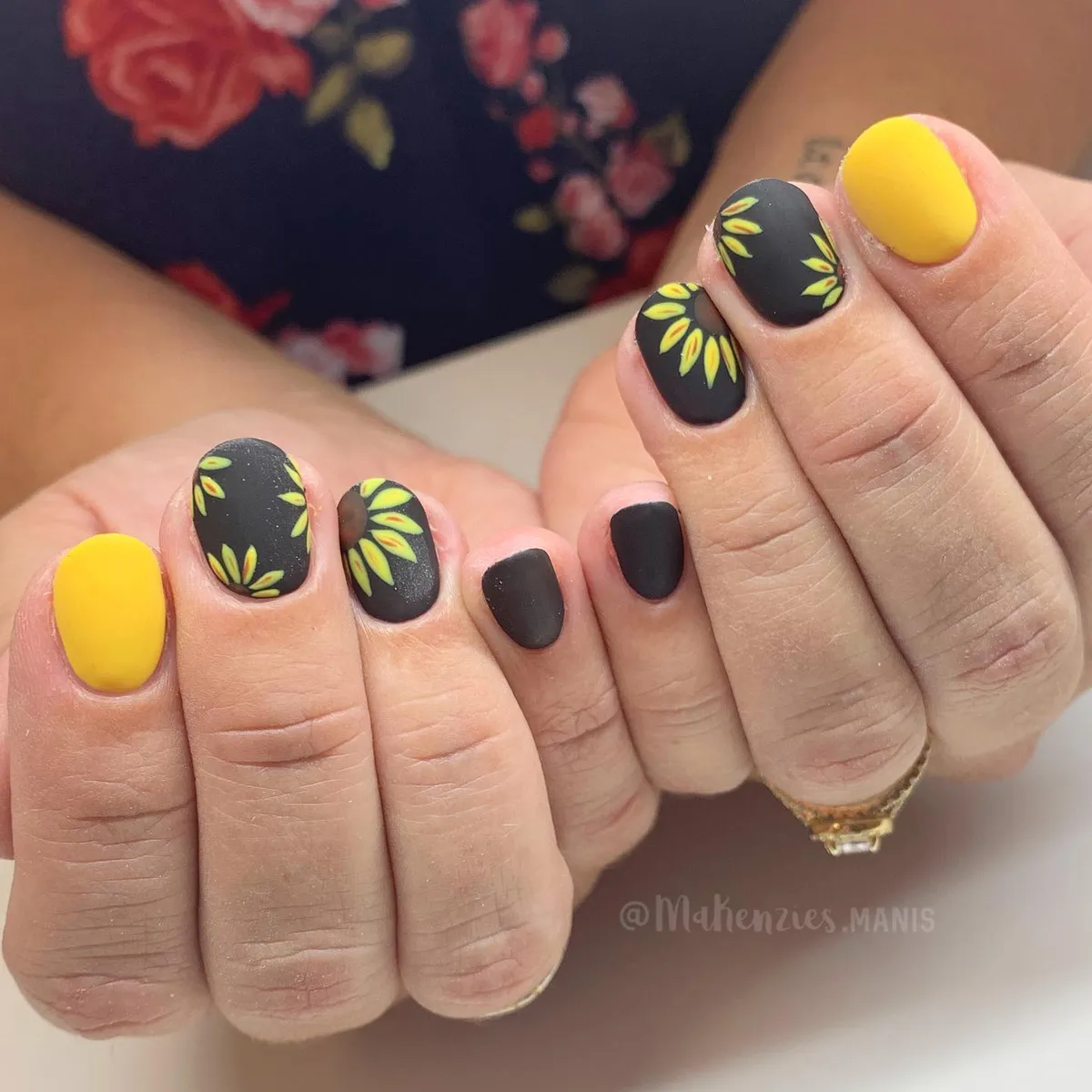 Matte black with yellow petal halos and yellow thumbs