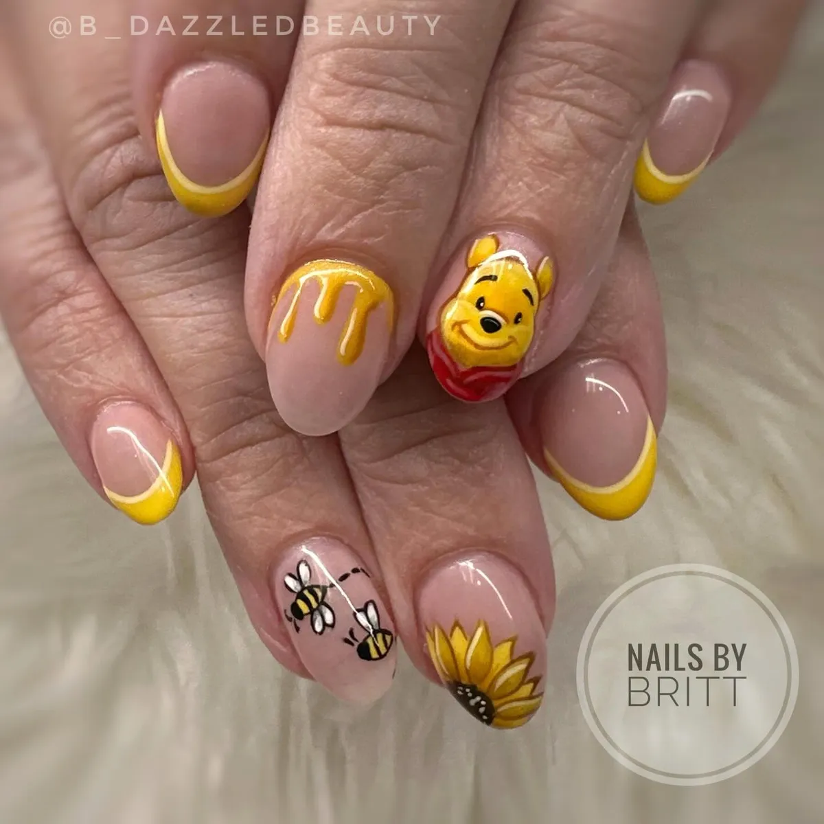 Yellow French tips with bees and sunflower accents