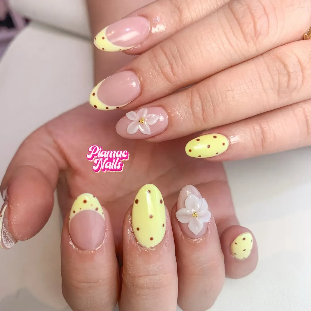 Pale yellow dotted tips with raised white flowers