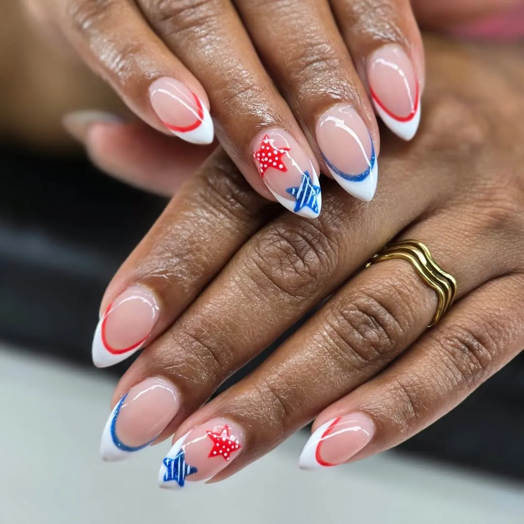 Outlined French tips with red-and-blue star accents