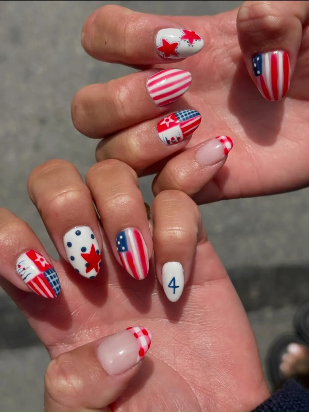 Stripes, stars, and a blue '4' accent nail