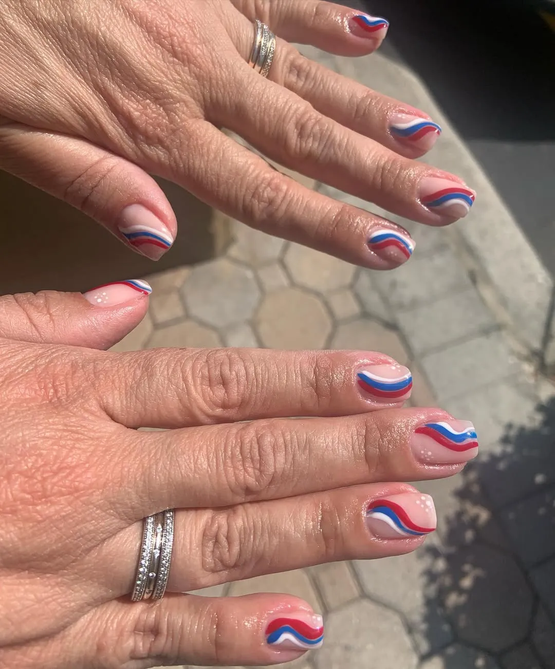 Nude base with wavy red-white-blue tip lines