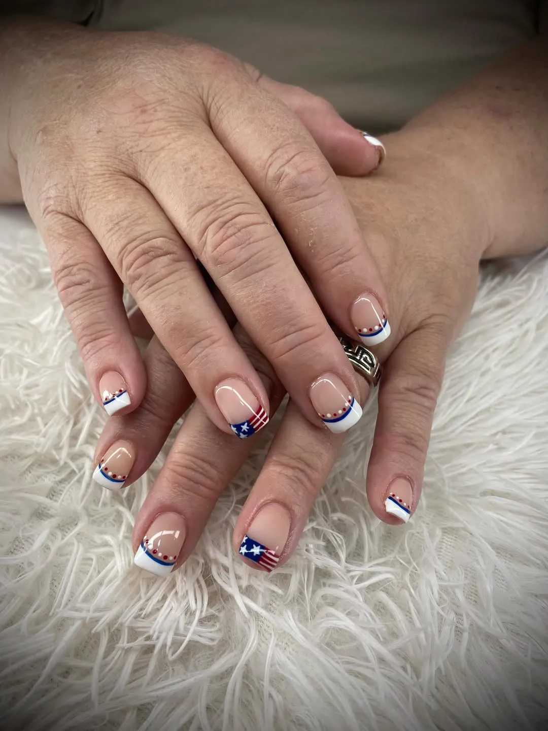White tips with blue line-and-red-dot detail plus star-and-stripe accents