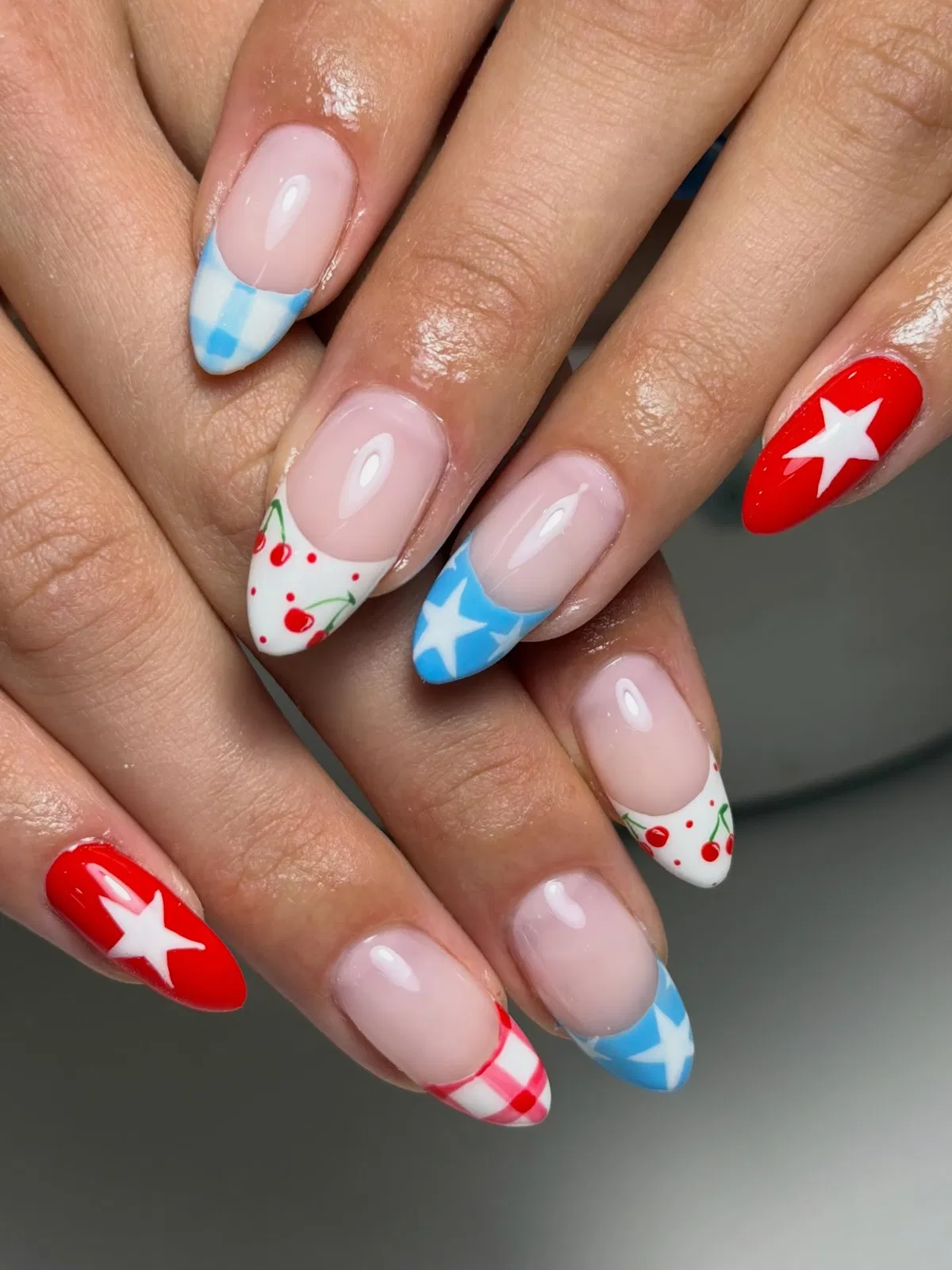 Almond tips with stars, cherries, and gingham in red/white/blue