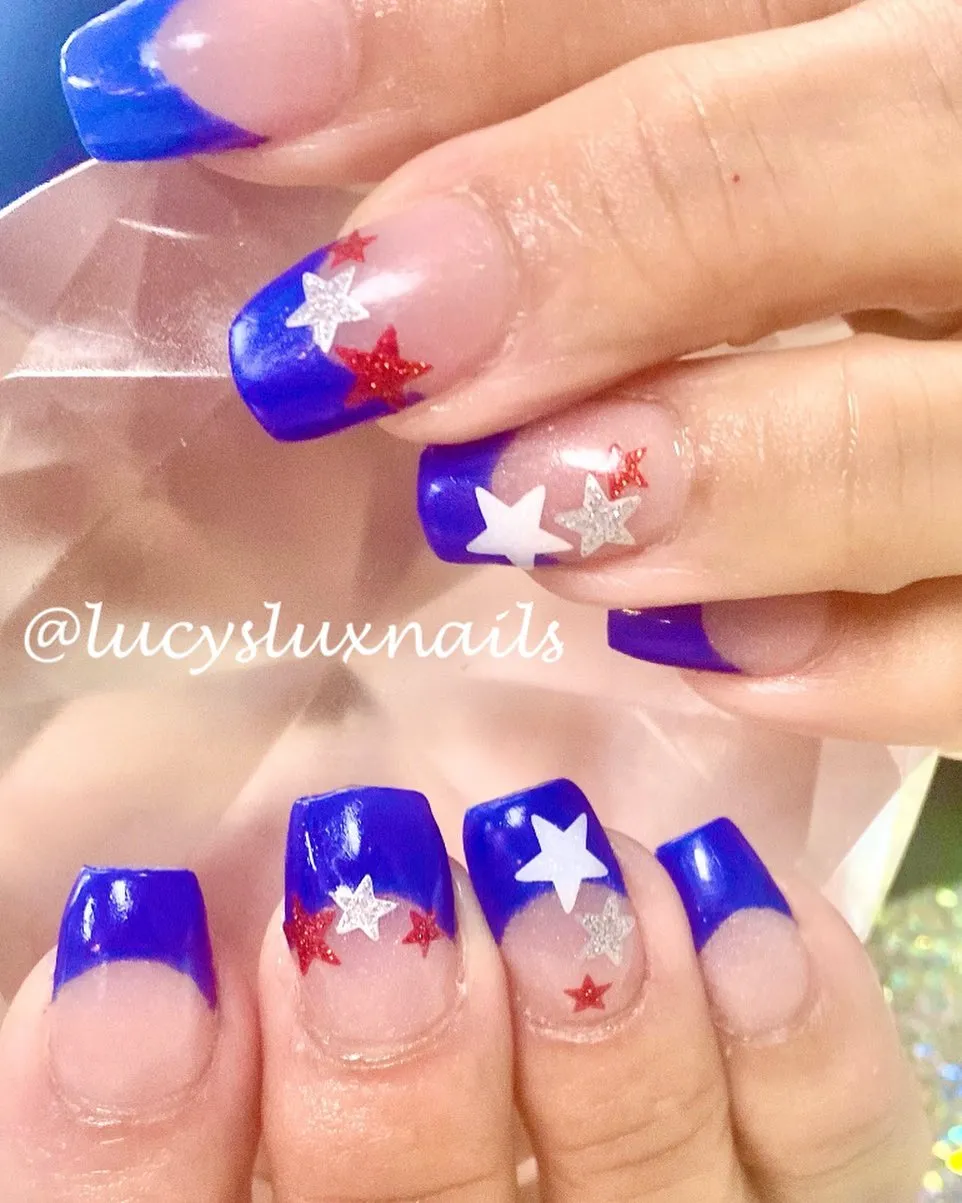 Blue French tips with red/white/silver stars