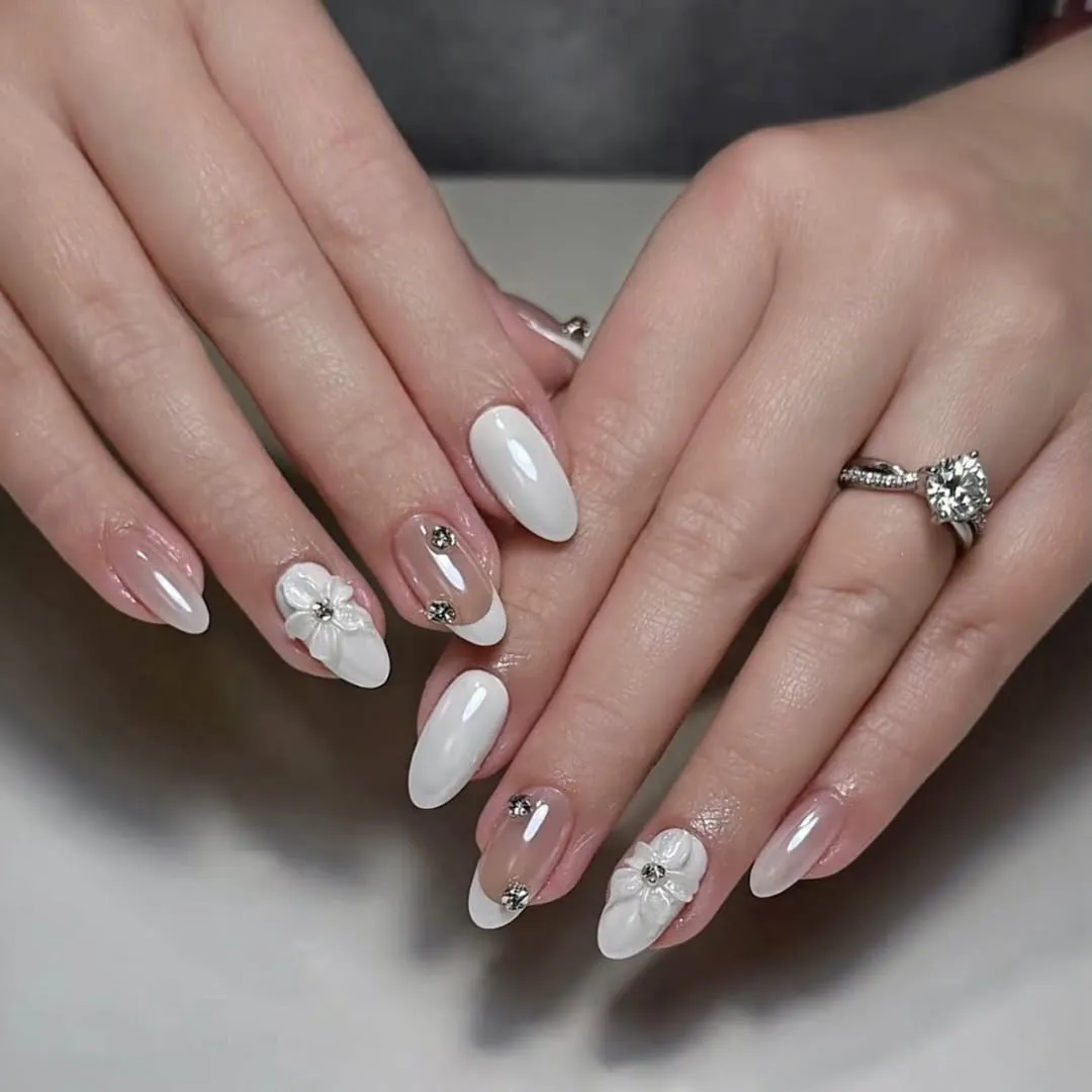 White French tips with 3D floral accents