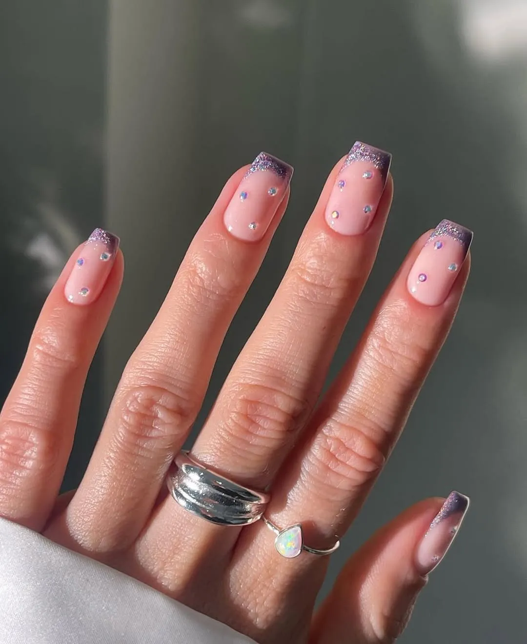 Purple glitter French tips with iridescent studs
