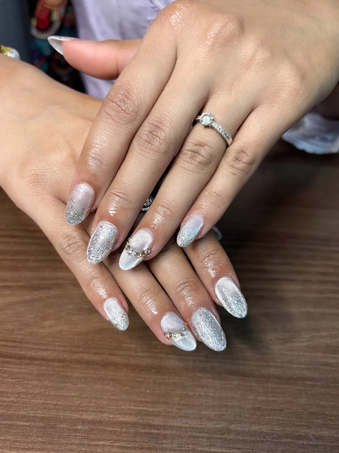 Silver glitter ombré nails with rhinestone cuticle arcs