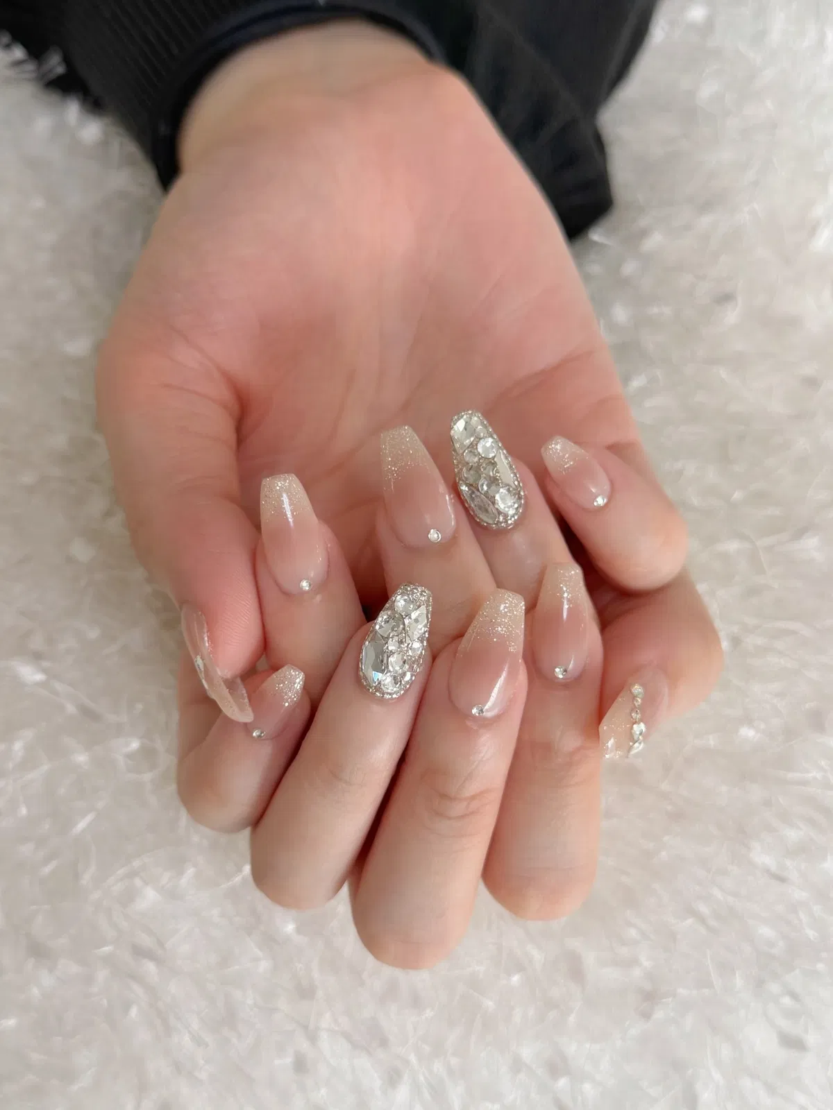 Nude glitter ombré with rhinestone statement nails