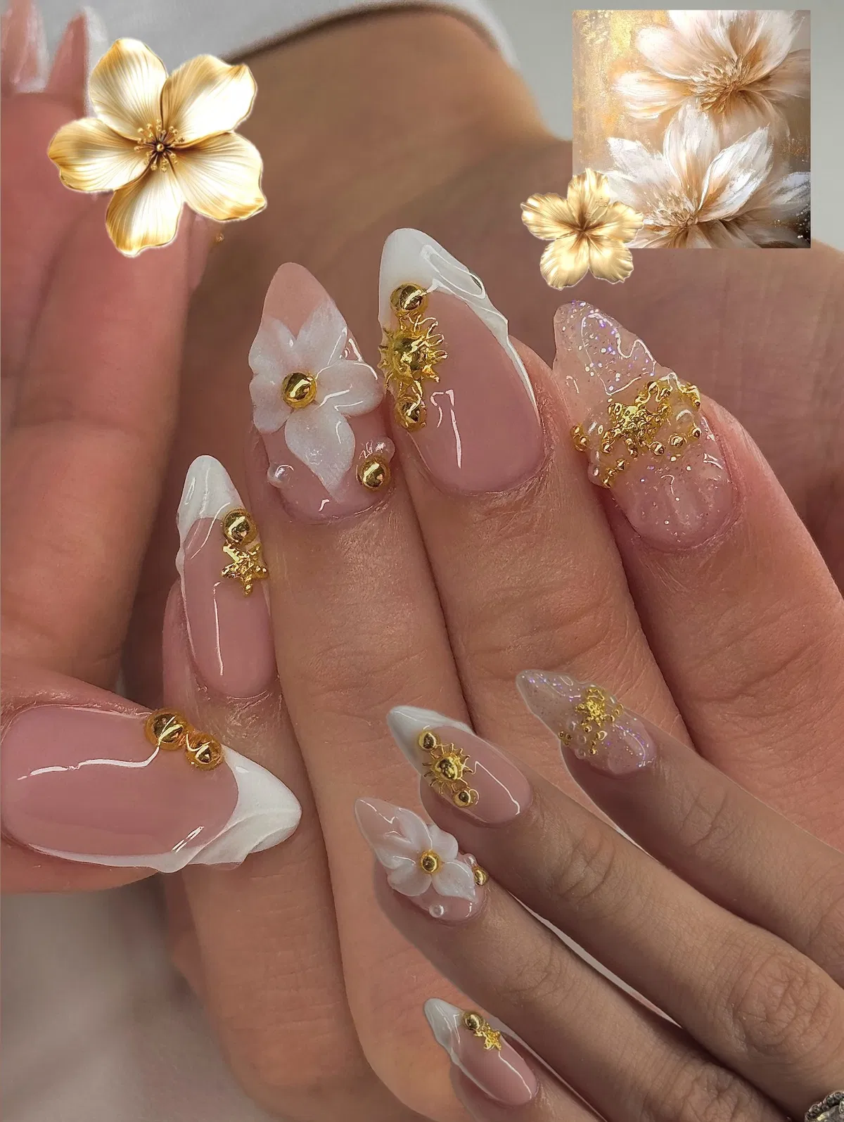 Long French tips with gold studs and white floral accents