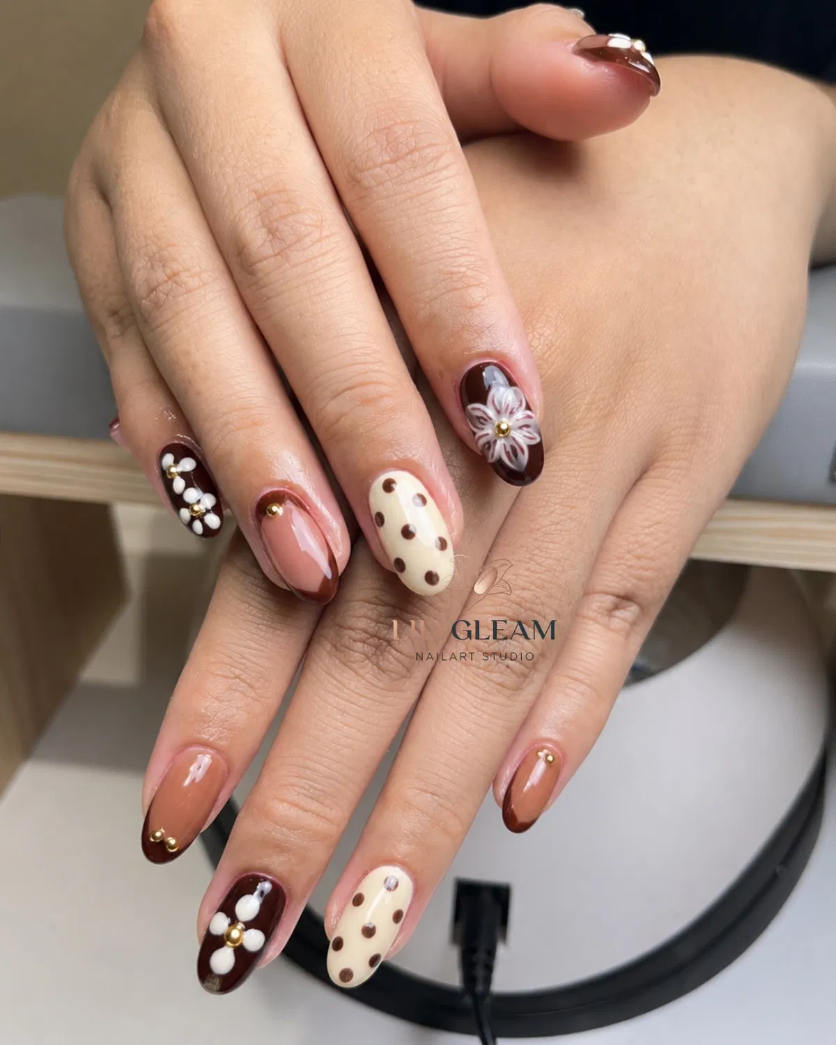 Cream-and-brown polka dots with floral accents and gold beads