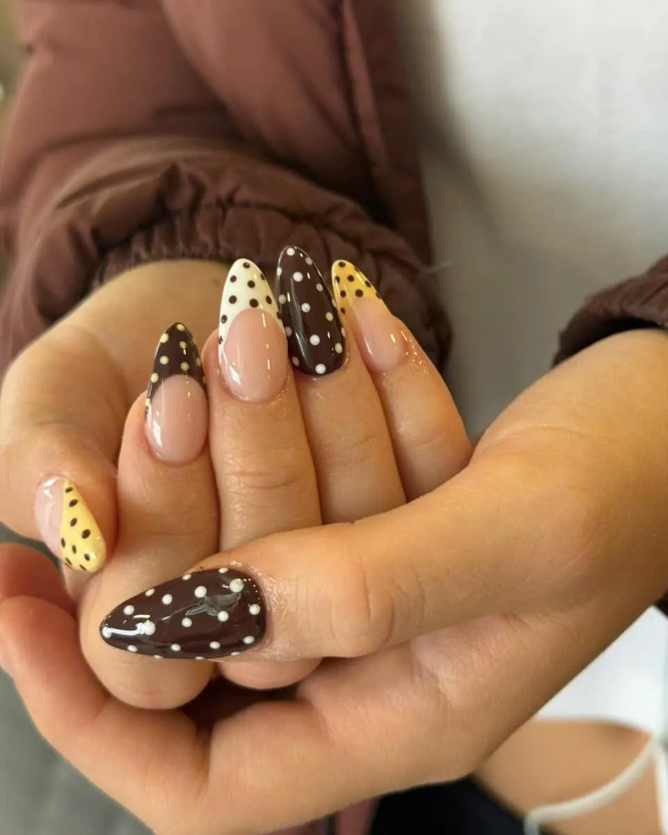 Brown polka dots with cream and yellow accent nails