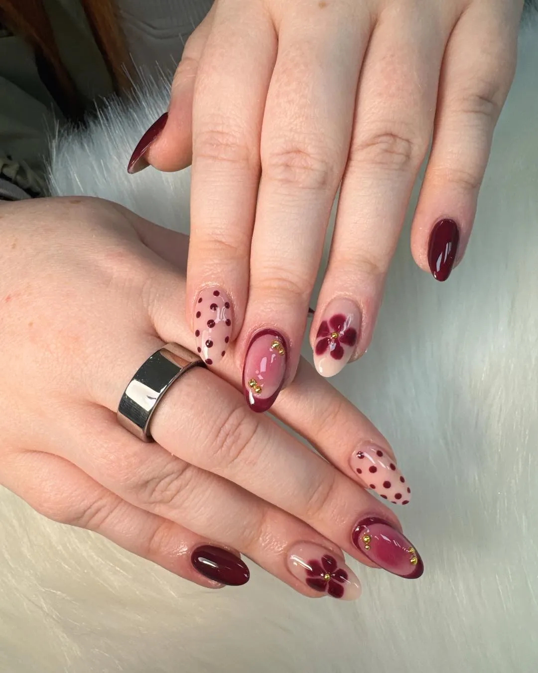 Burgundy polka dots with floral and gold-toned accents