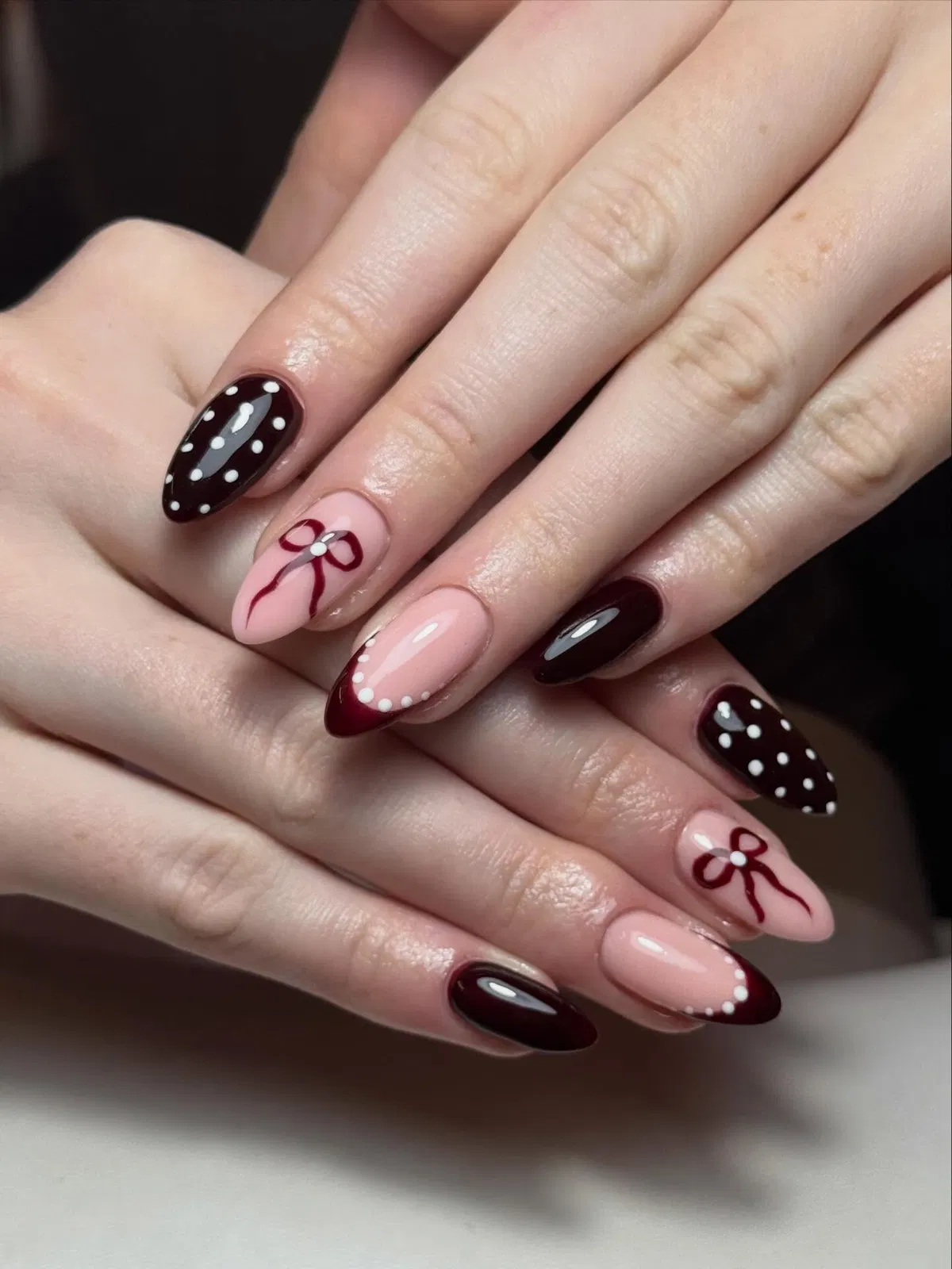 Dark burgundy polka dots with nude bow accents