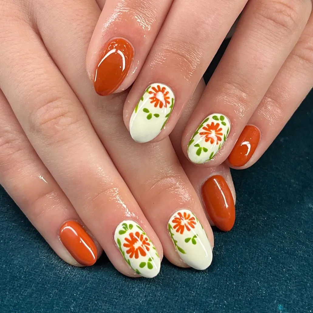 Burnt orange with white floral-and-green accents