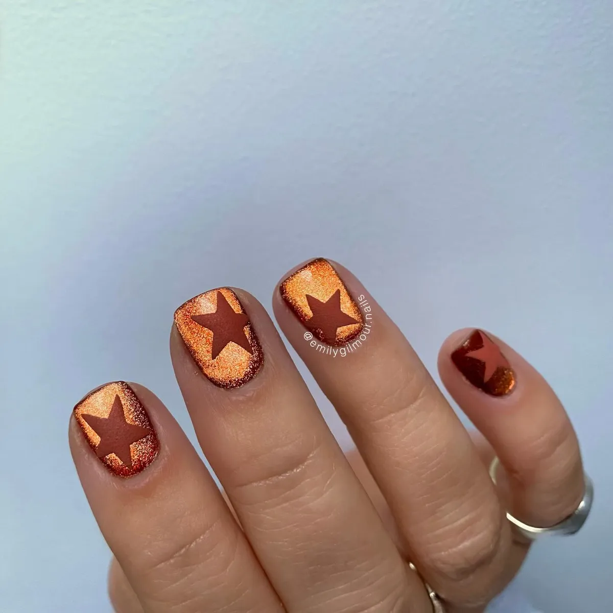 Metallic burnt orange with bold star shapes