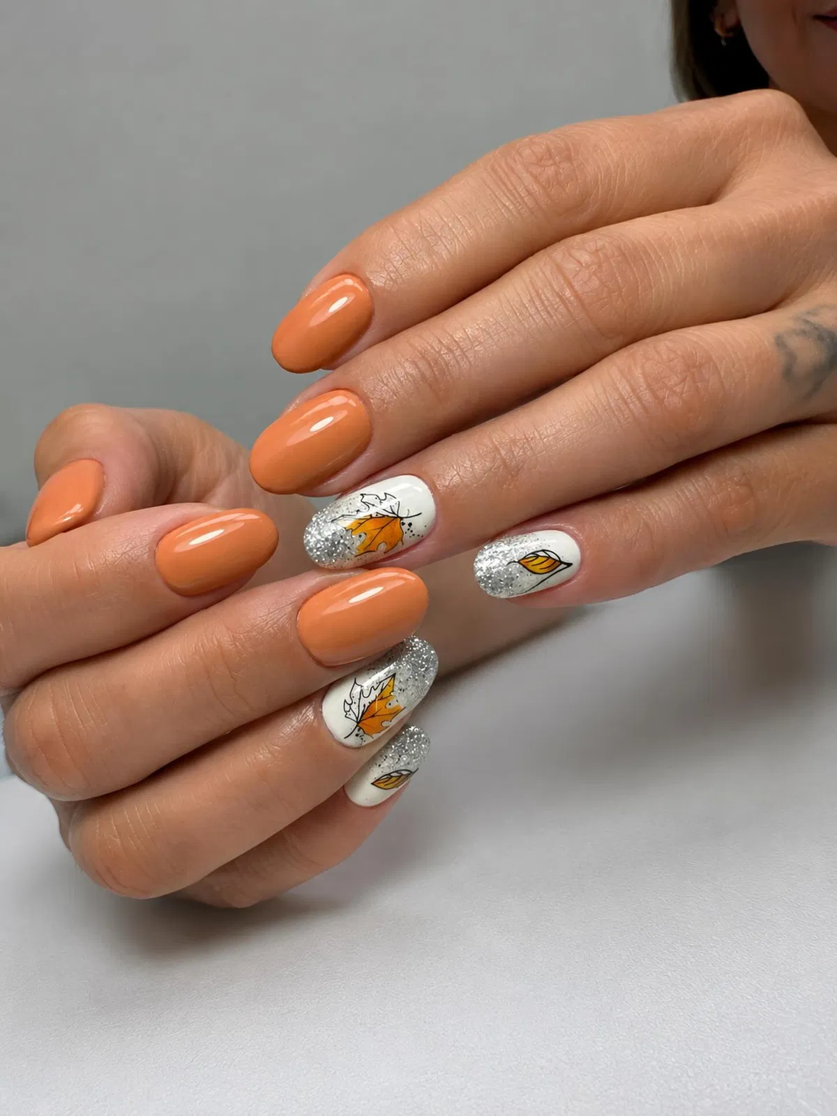 Soft Orange with Leaf Art and Silver Tips