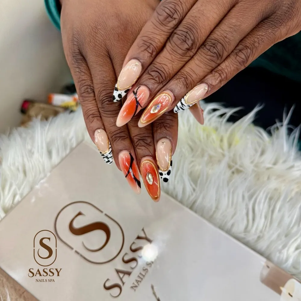 Orange mix with animal-style accents and a central gem