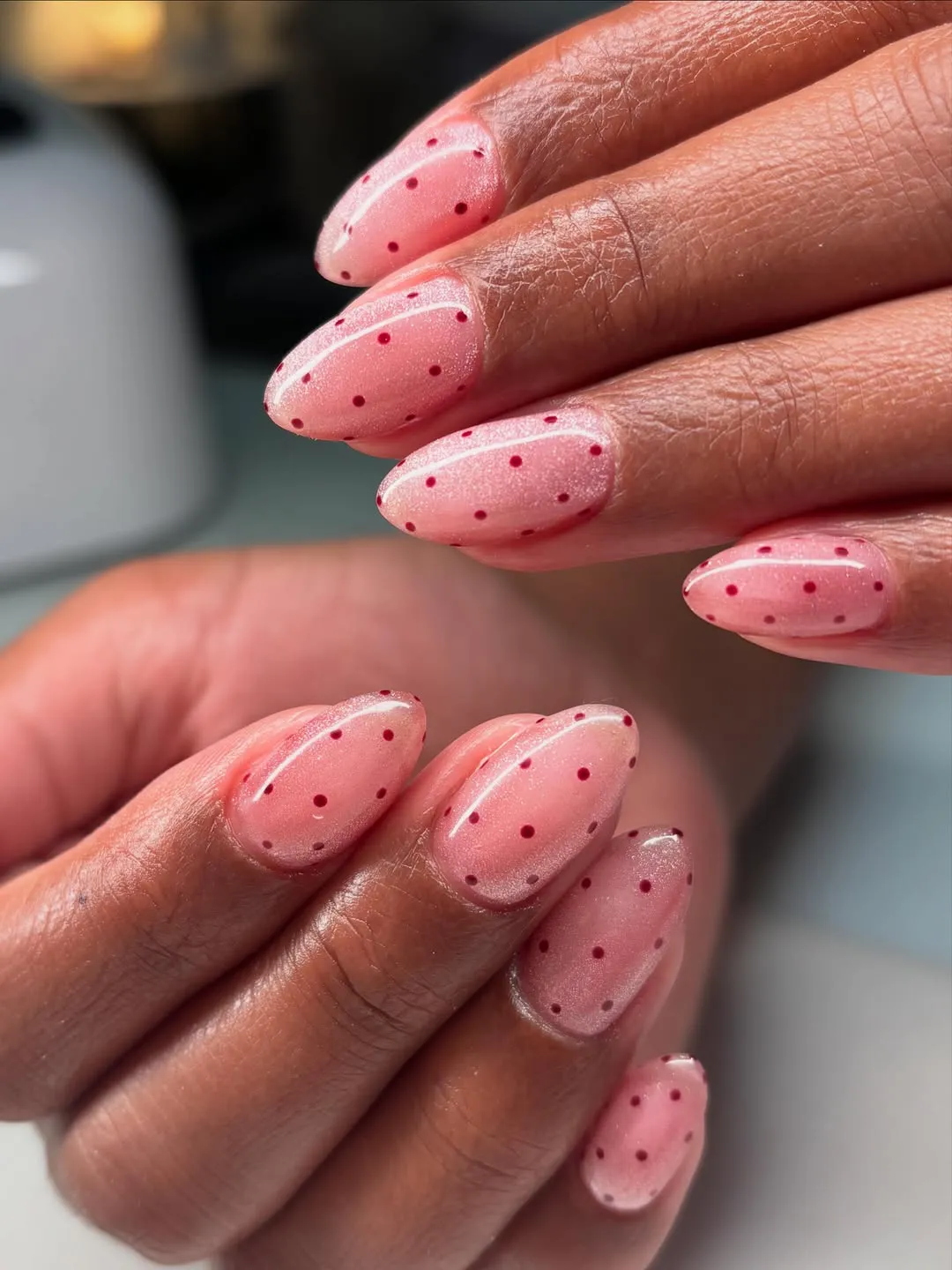 Pink shimmer polka dots (close-up view)