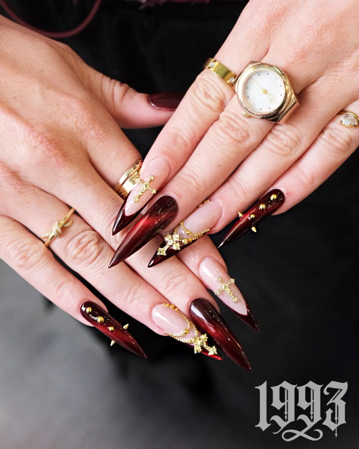 Extra-long cherry gradient stilettos with gold 3D embellishments