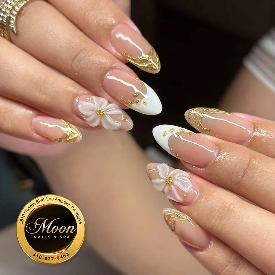 Gold-accented almond tips with 3D white flowers
