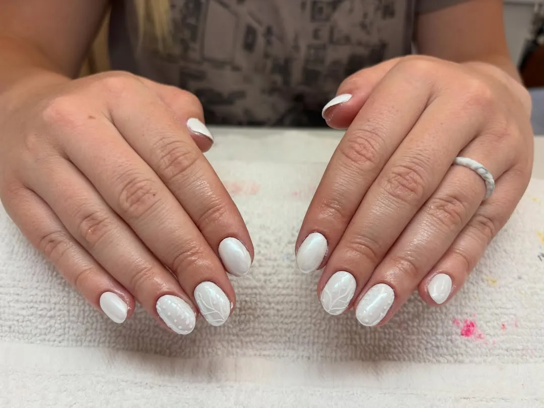 Short opaque white nails with subtle white line art