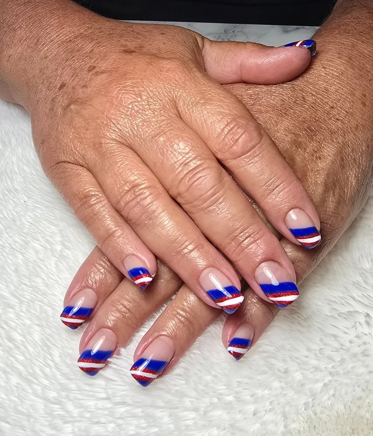 Nude Base with Blue Angled Tips and Red/White Striping