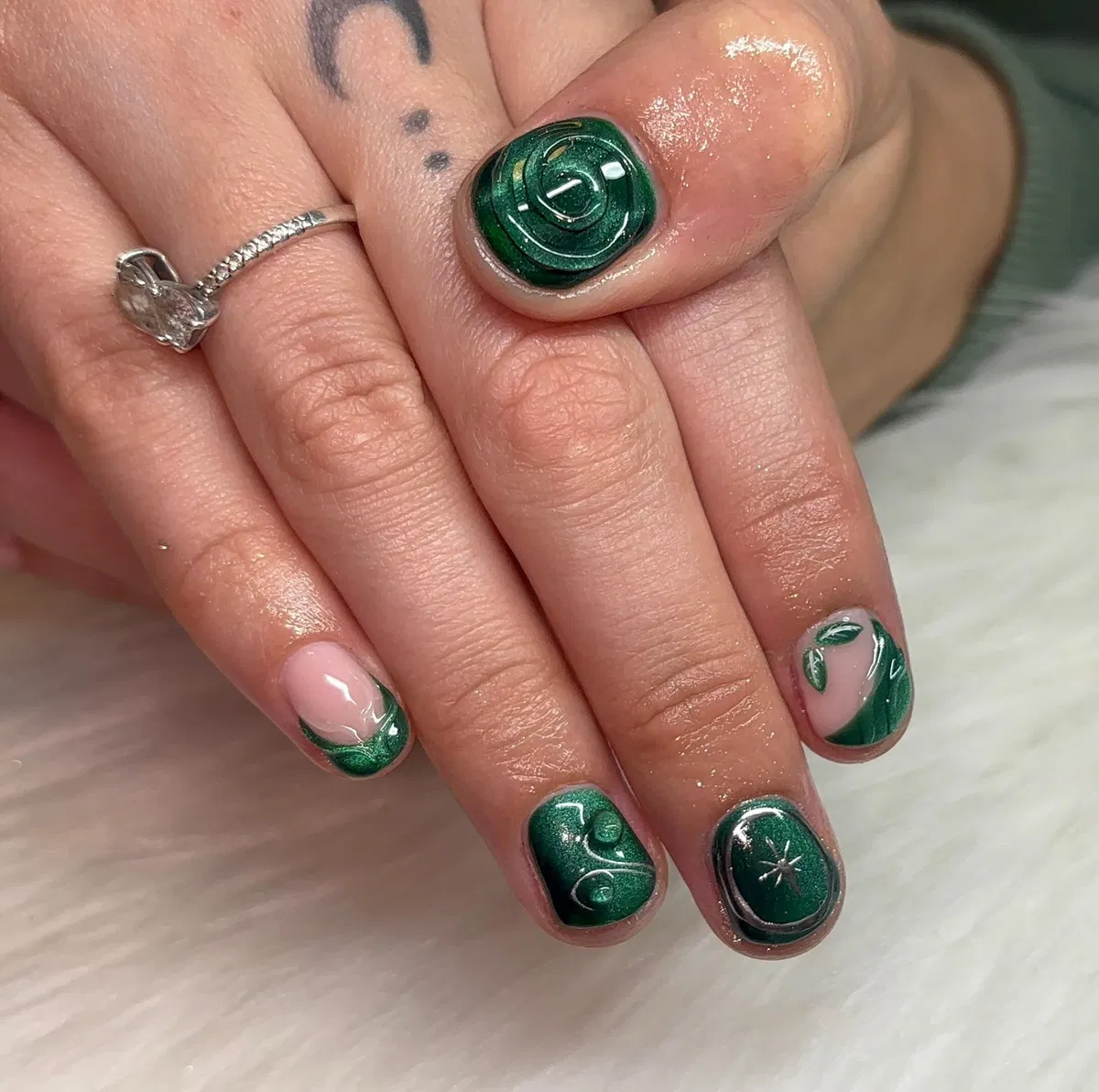 Short dark green metallic look with raised swirls
