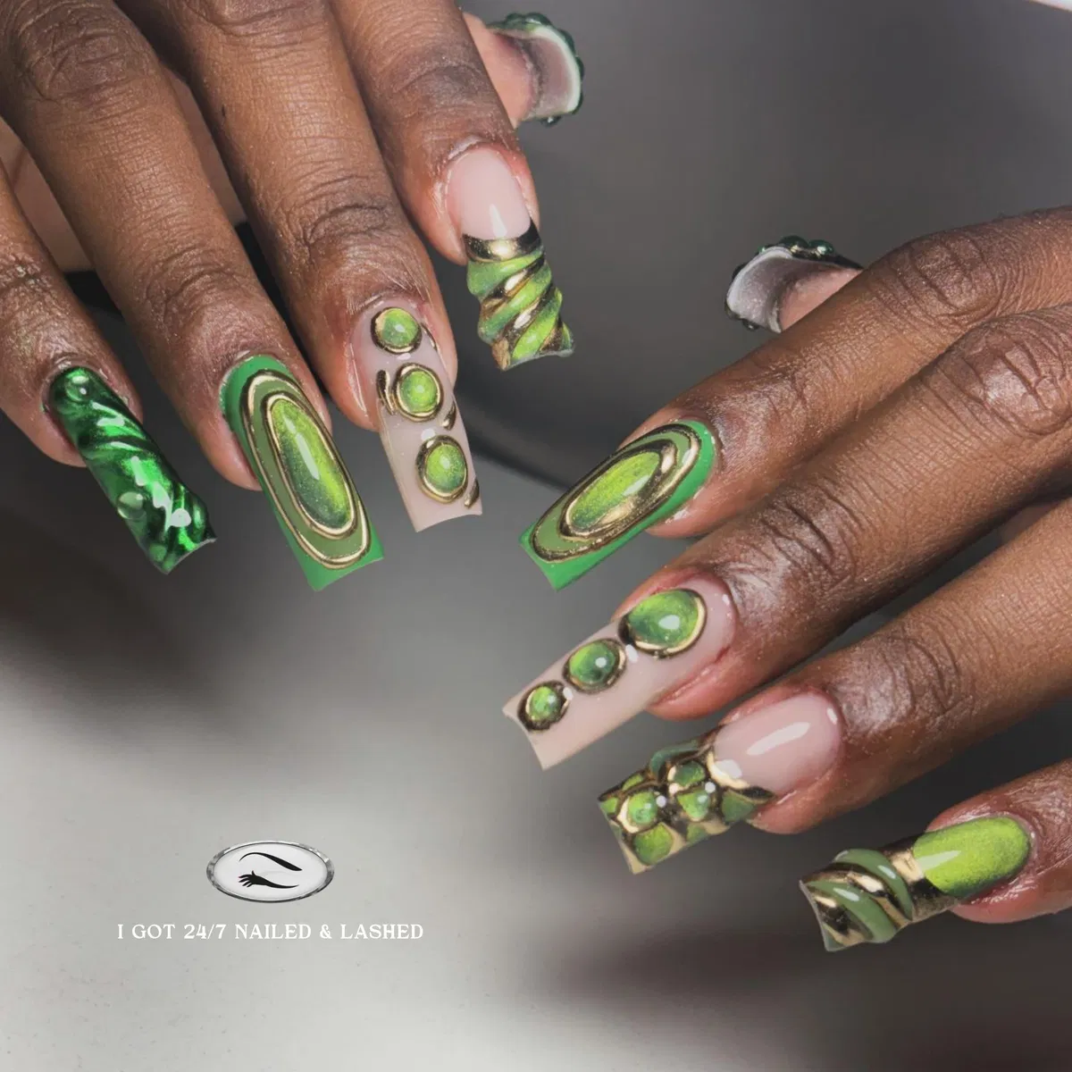 Long green-and-gold framed designs with raised circular accents