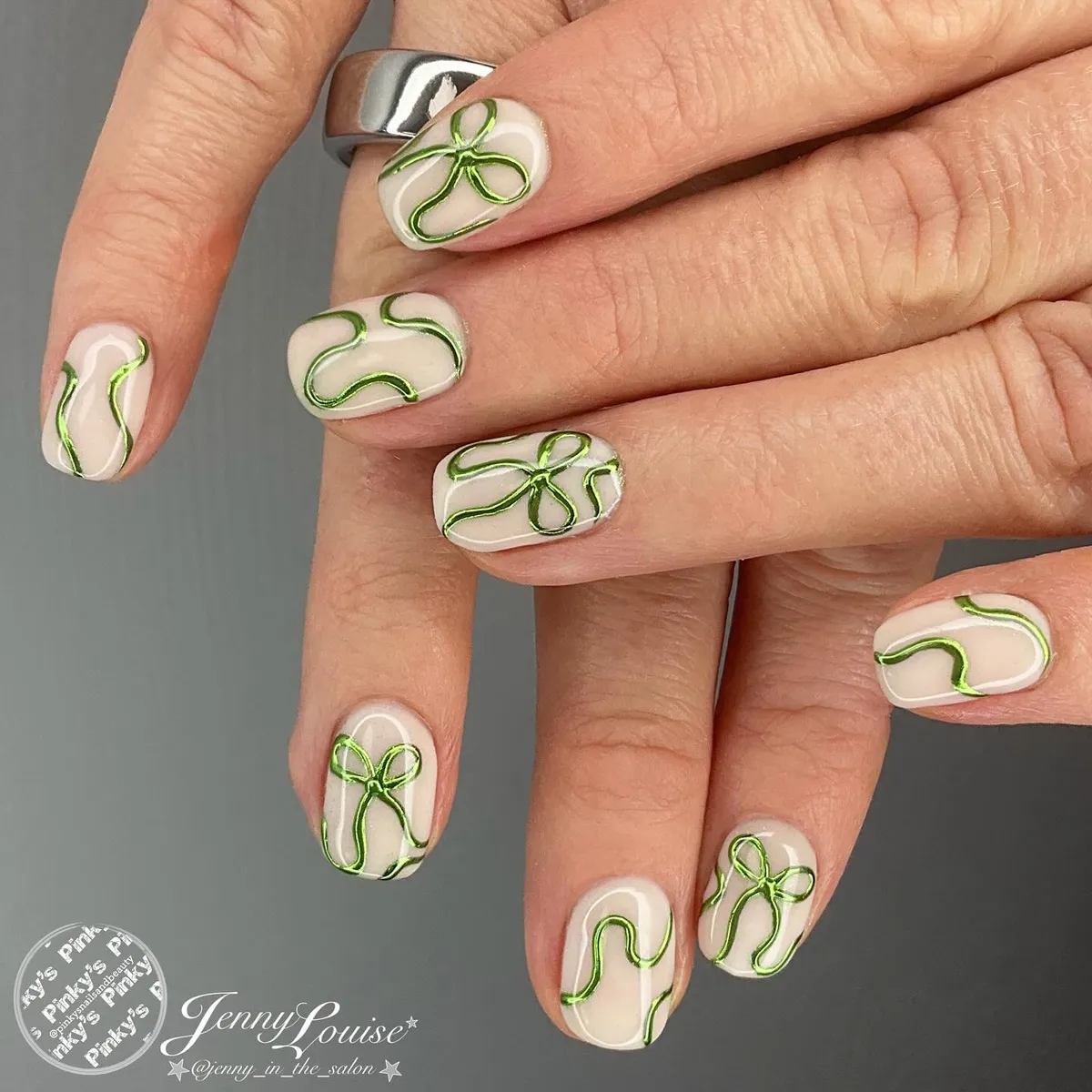 Short nude nails with raised metallic green line art
